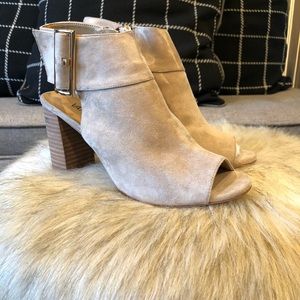 Suede heels with gold buckle.